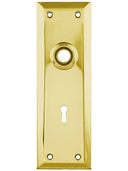 Stamped Brass New York Back Plate With Keyhole in Unlacquered Brass.